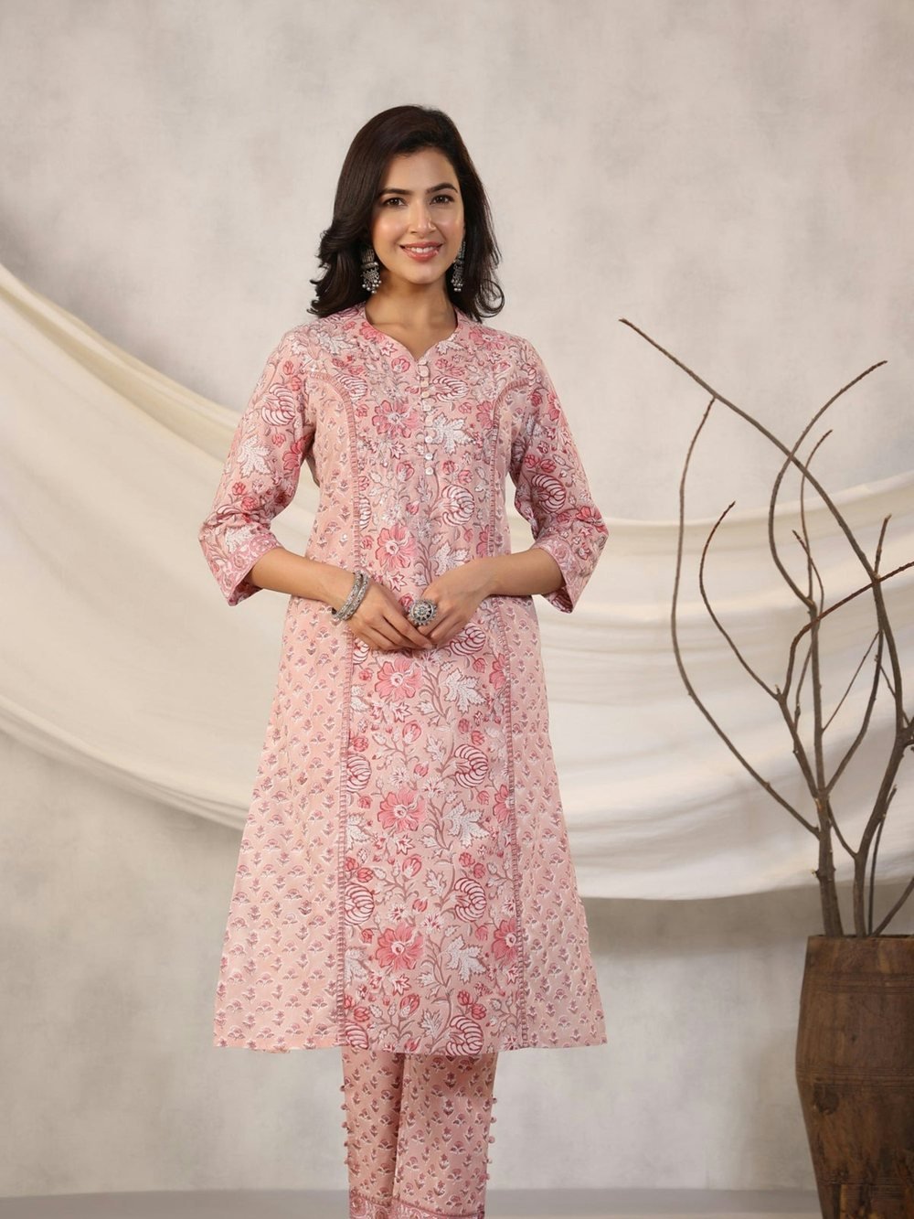 Woman wearing a pink block-print kurta set